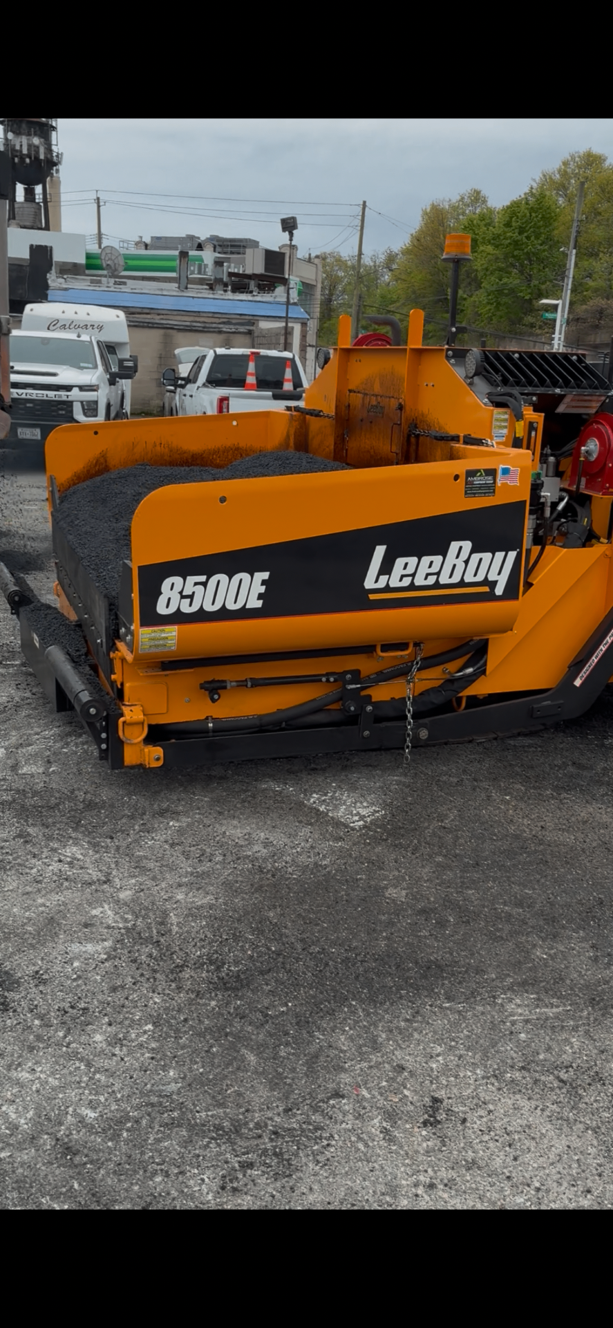 LeeBoy 8500E asphalt paver loaded with hot mix, ready to lay a fresh mat